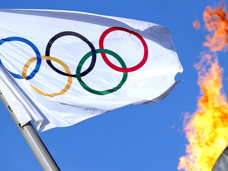 061714-oly-the-olympic-flag-flutters-near-the-cauldron-at-the-olympic-park-pi.jpg