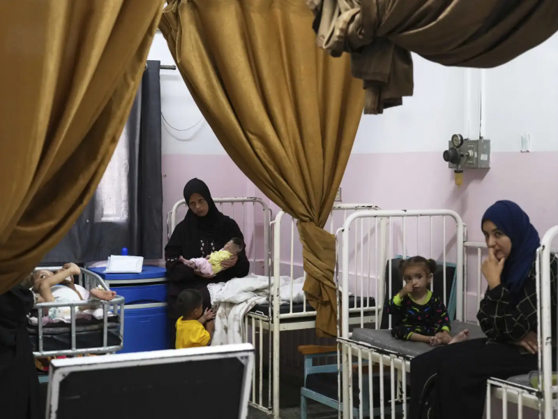 Mayar Al-Arja, 2, right, and 5-month-old Yousef Al-Najjar, both suffering from malnutrition, are cared for by their mothers in a clinic in Nasser Hospital, Khan Younis, Gaza, on Wednesday, May 21, 2025. (AP Photo/Abdel Kareem Hana)