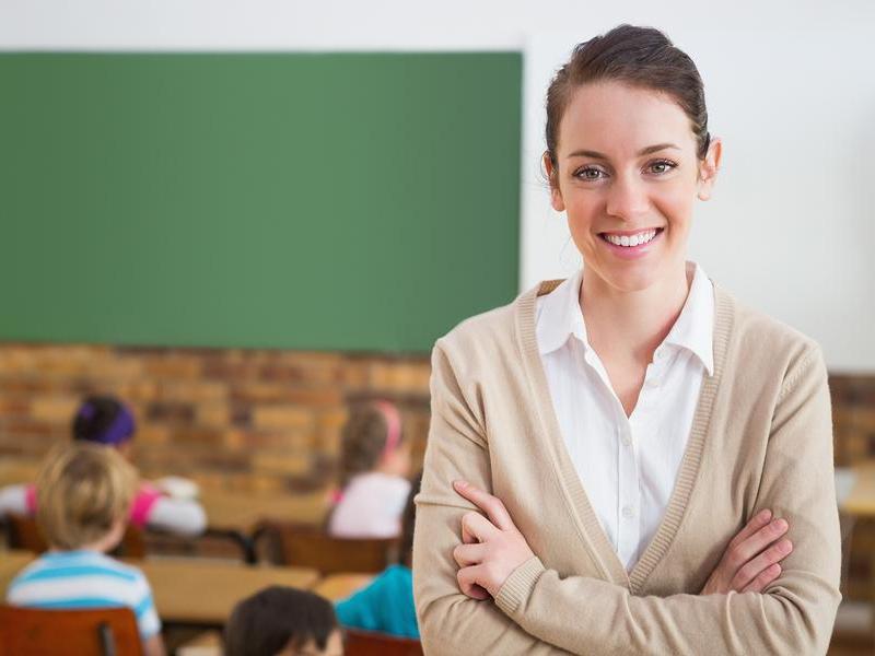 bigstock-pretty-teacher-smiling-at-came-69887626_10.jpg