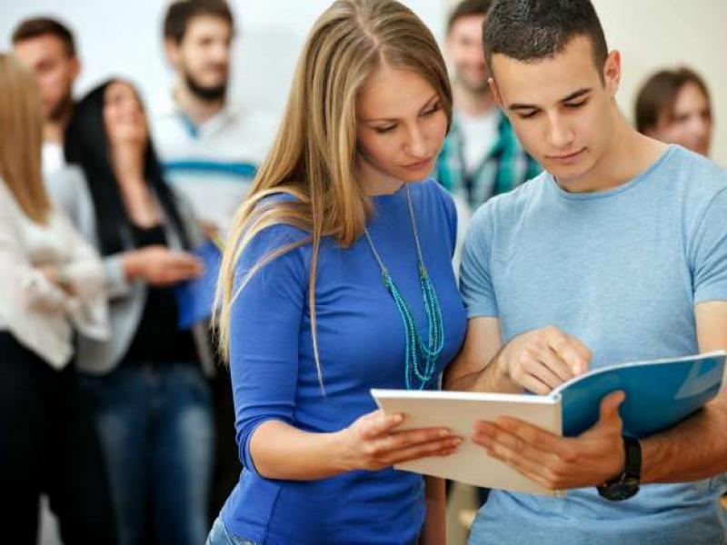 bigstock-two-college-students-reading-b-49888535_3.jpg