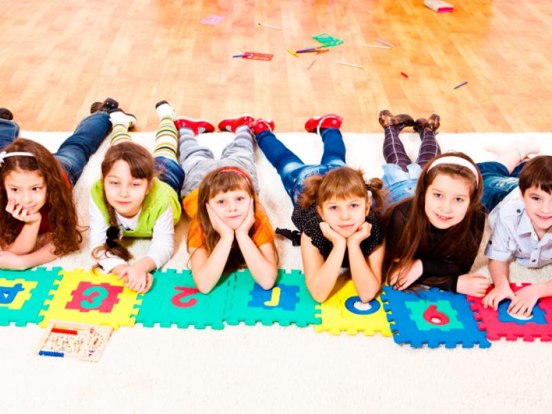 kids-at-school-laying-on-floor-mat.jpg