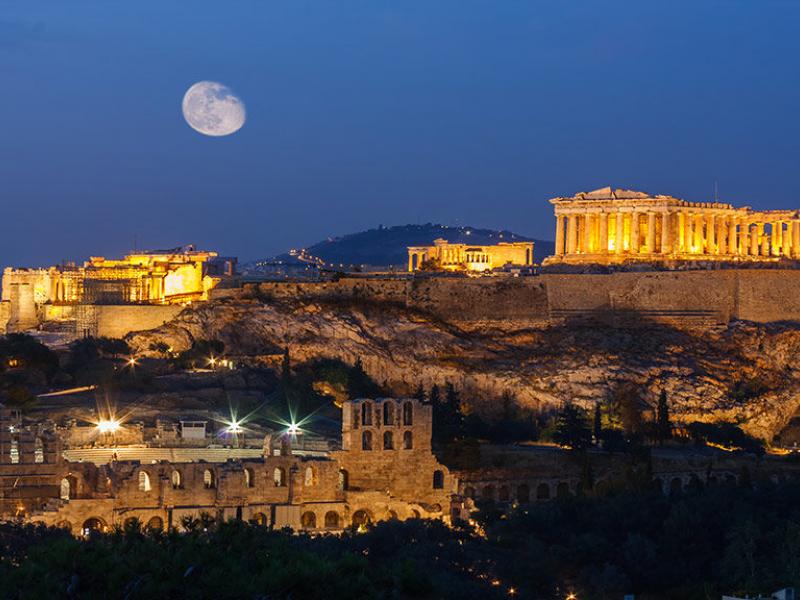 parthenon-and-herodium-construction-in-acropolis-hill-in-athens-greece-shot-in-blue-hour-with-moon-in-the-sky-1021x576.jpg